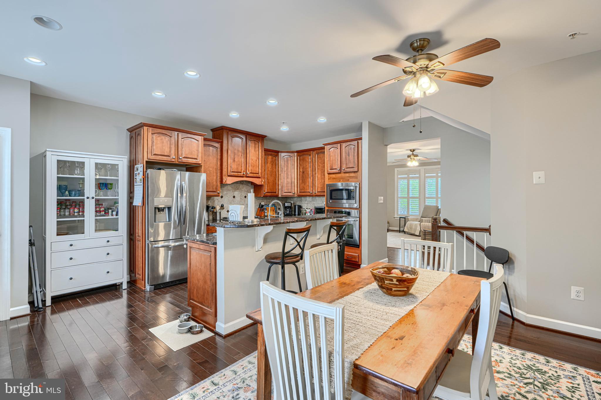 432 Grand Street Gaithersburg, MD 20878 - Photo 15 of 48 a view of a dining room with furniture window and wooden floor