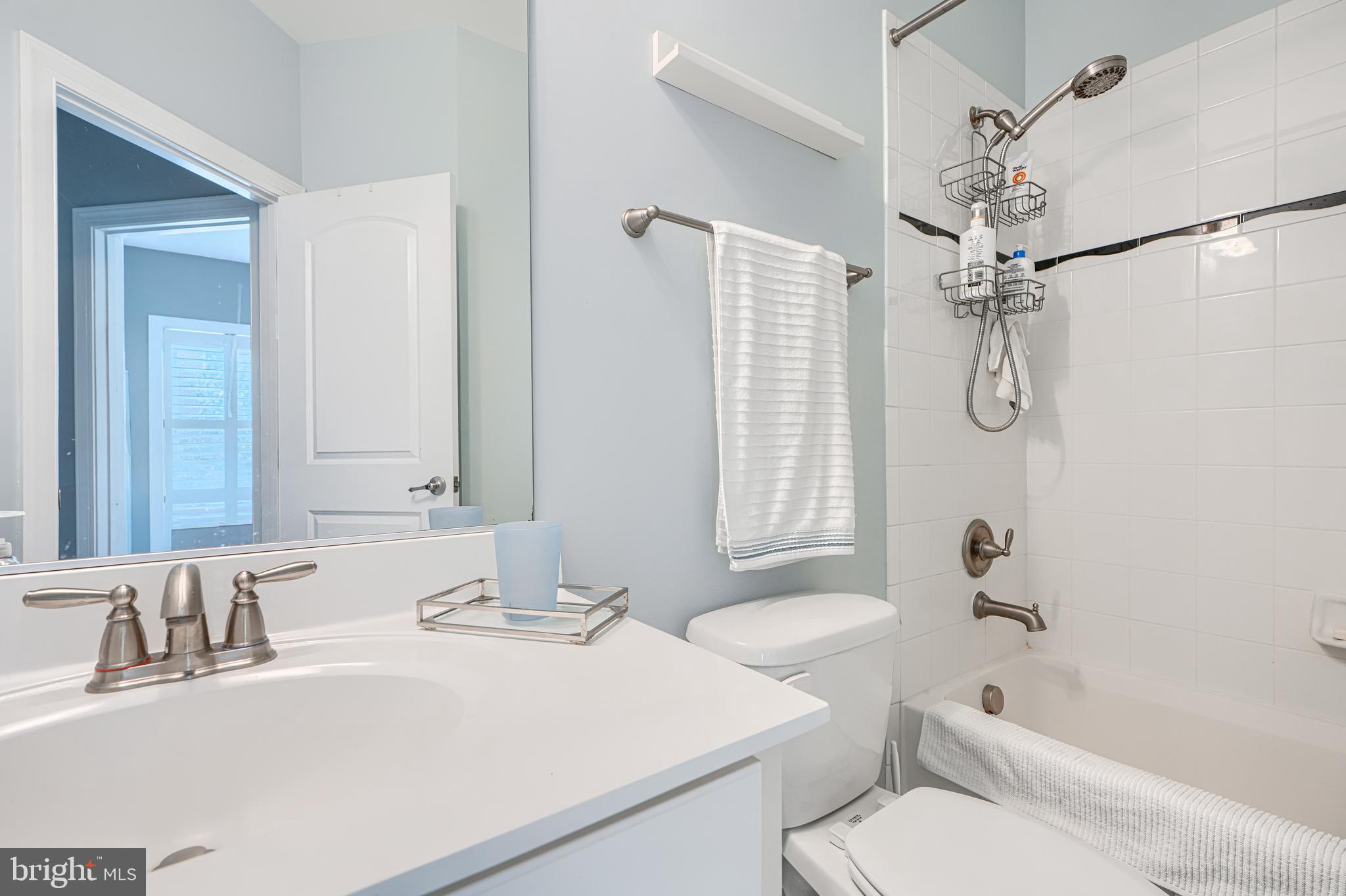 432 Grand Street Gaithersburg, MD 20878 - Photo 29 of 48 a bathroom with a granite countertop sink a toilet and shower