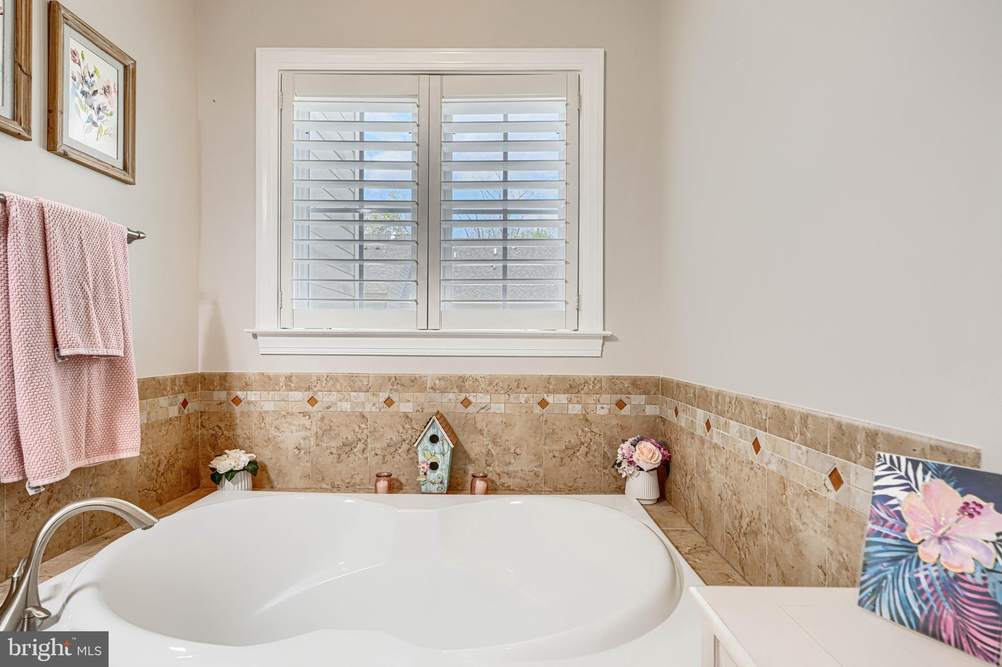 432 Grand Street Gaithersburg, MD 20878 - Photo 35 of 48 a white bath tub sitting in a bathroom next to a window