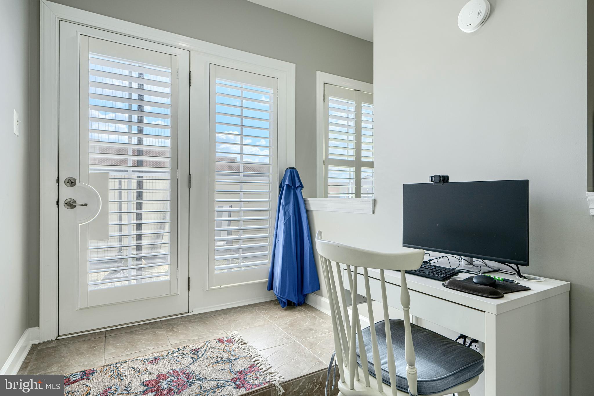 432 Grand Street Gaithersburg, MD 20878 - Photo 37 of 48 a view of a workspace with furniture and a window