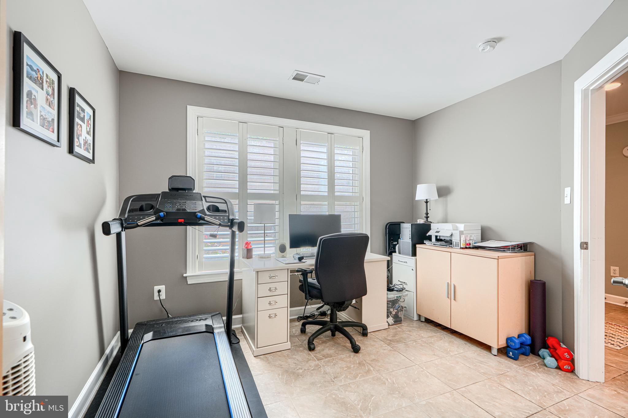 432 Grand Street Gaithersburg, MD 20878 - Photo 5 of 48 a view of a workspace with furniture and a window