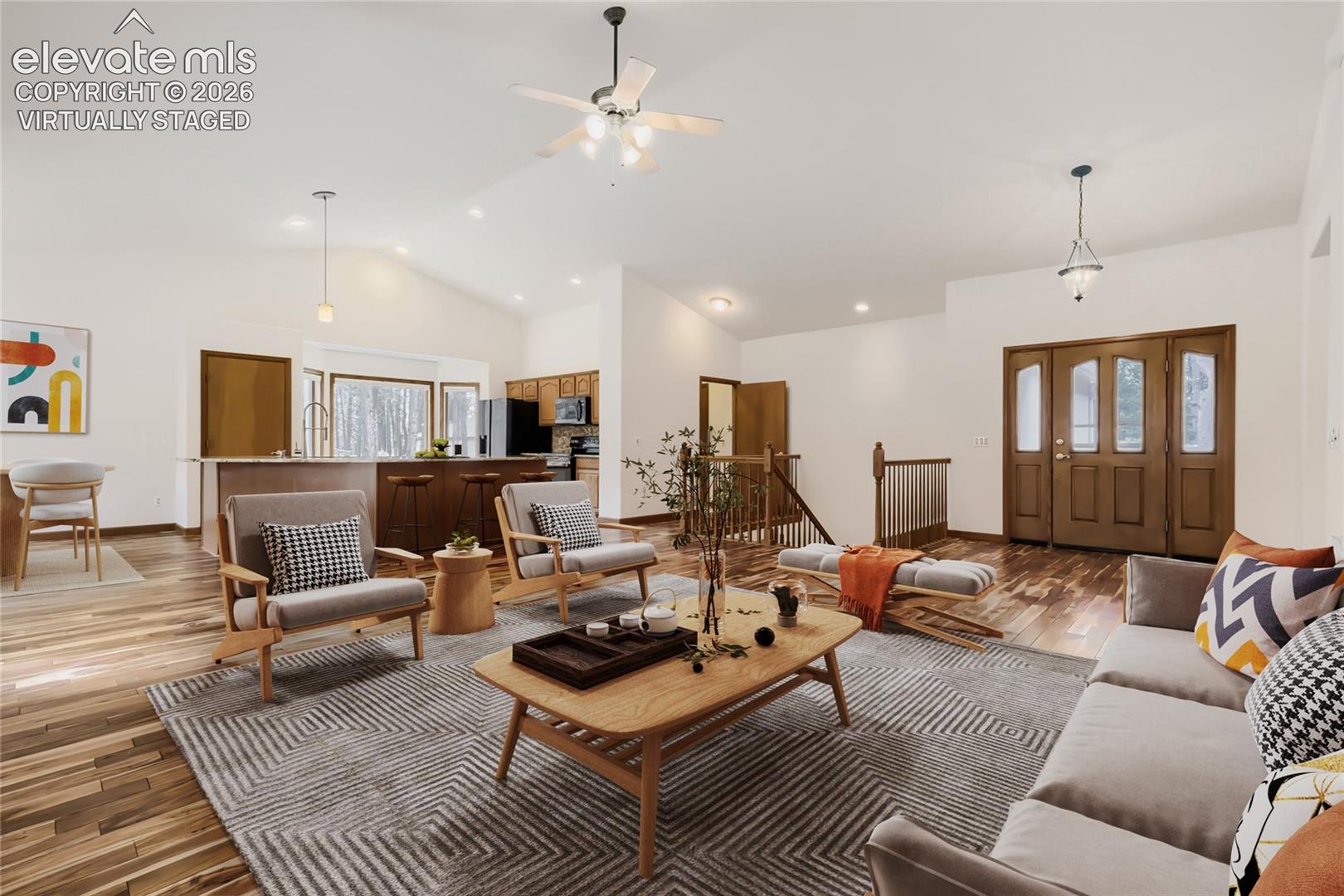 Virtually staged living room off entry with gas fireplace and open sight lines to kitchen and  dining.