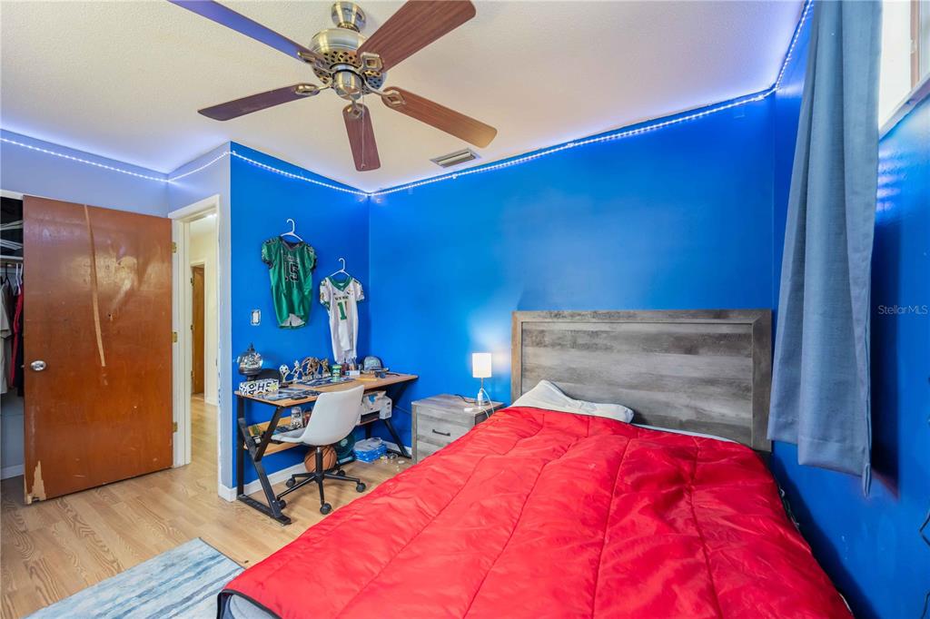 3254 Elliott Street Venice, FL 34292 - Photo 13 of 23 a bedroom with a bed and a table