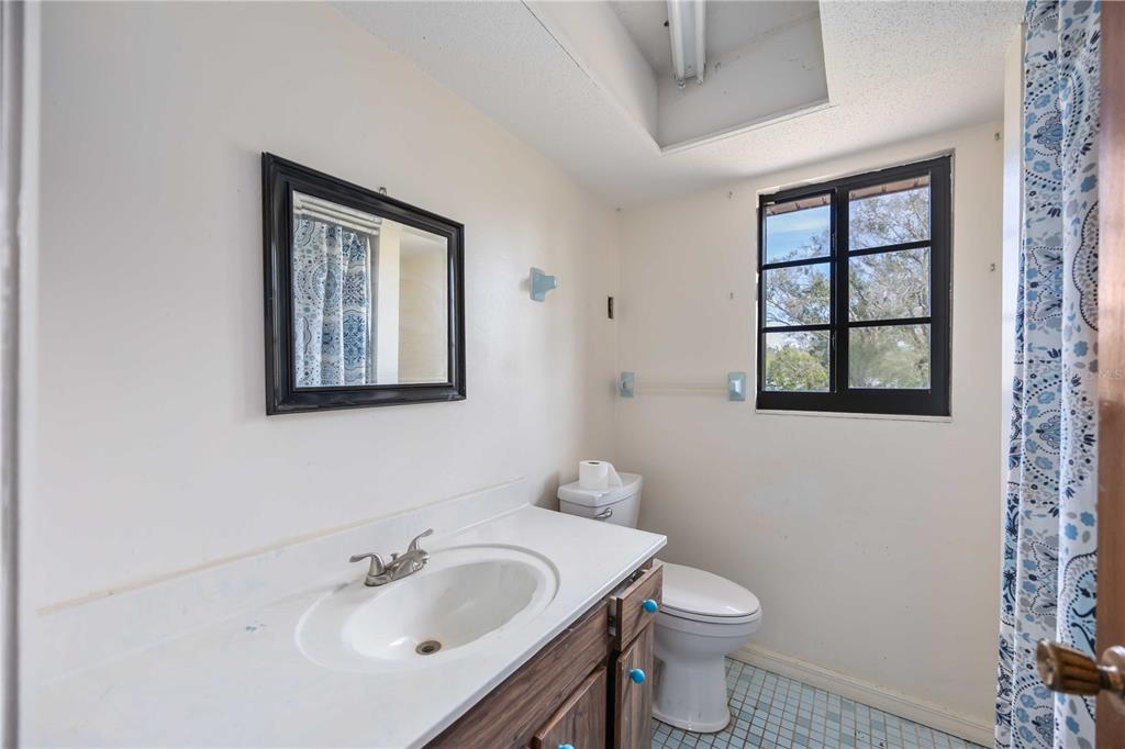 3254 Elliott Street Venice, FL 34292 - Photo 15 of 23 a bathroom with a sink and a toilet