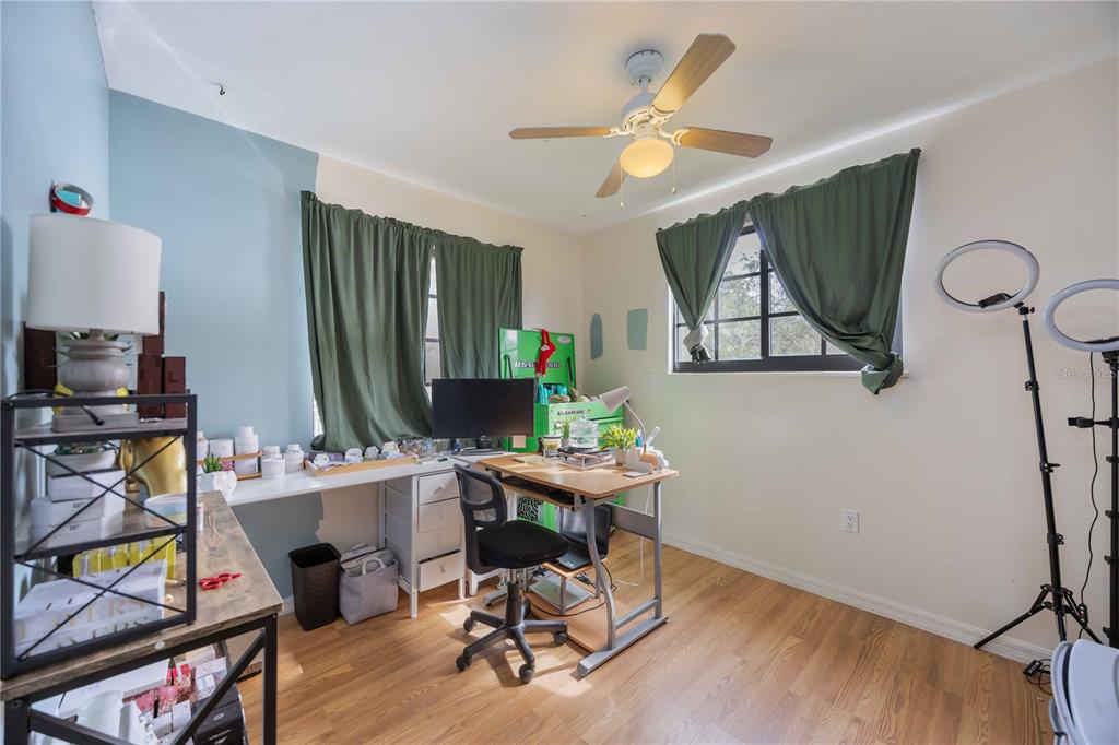 3254 Elliott Street Venice, FL 34292 - Photo 16 of 23 a view of a workspace with furniture and a window