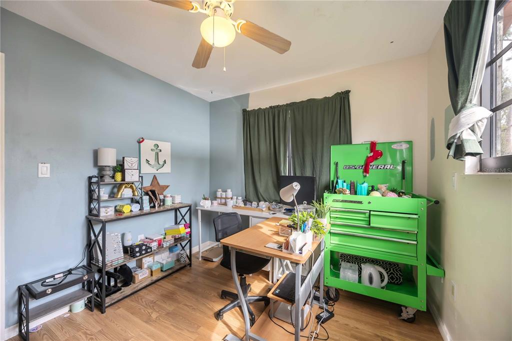 3254 Elliott Street Venice, FL 34292 - Photo 17 of 23 a living room with furniture and a wooden floor