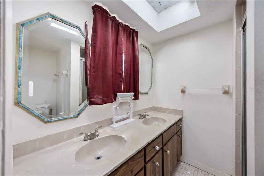 3254 Elliott Street Venice, FL 34292 - Photo 19 of 23 a bathroom with a sink and a mirror