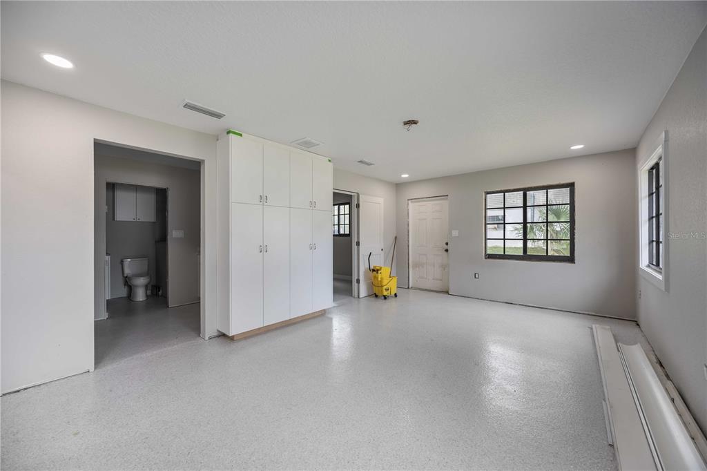 3254 Elliott Street Venice, FL 34292 - Photo 23 of 23 a view of an empty room with a window and a kitchen