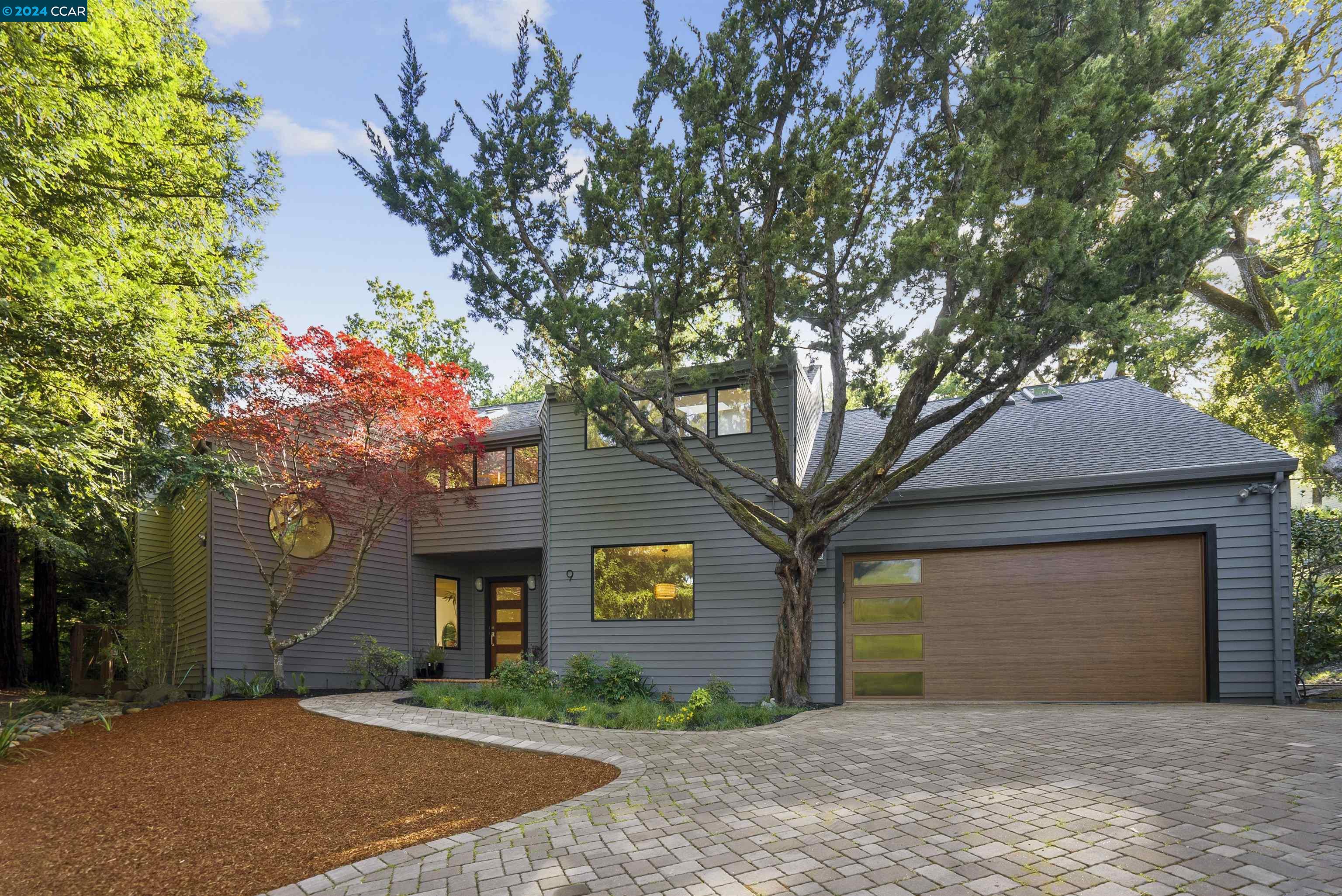 a front view of a house with yard