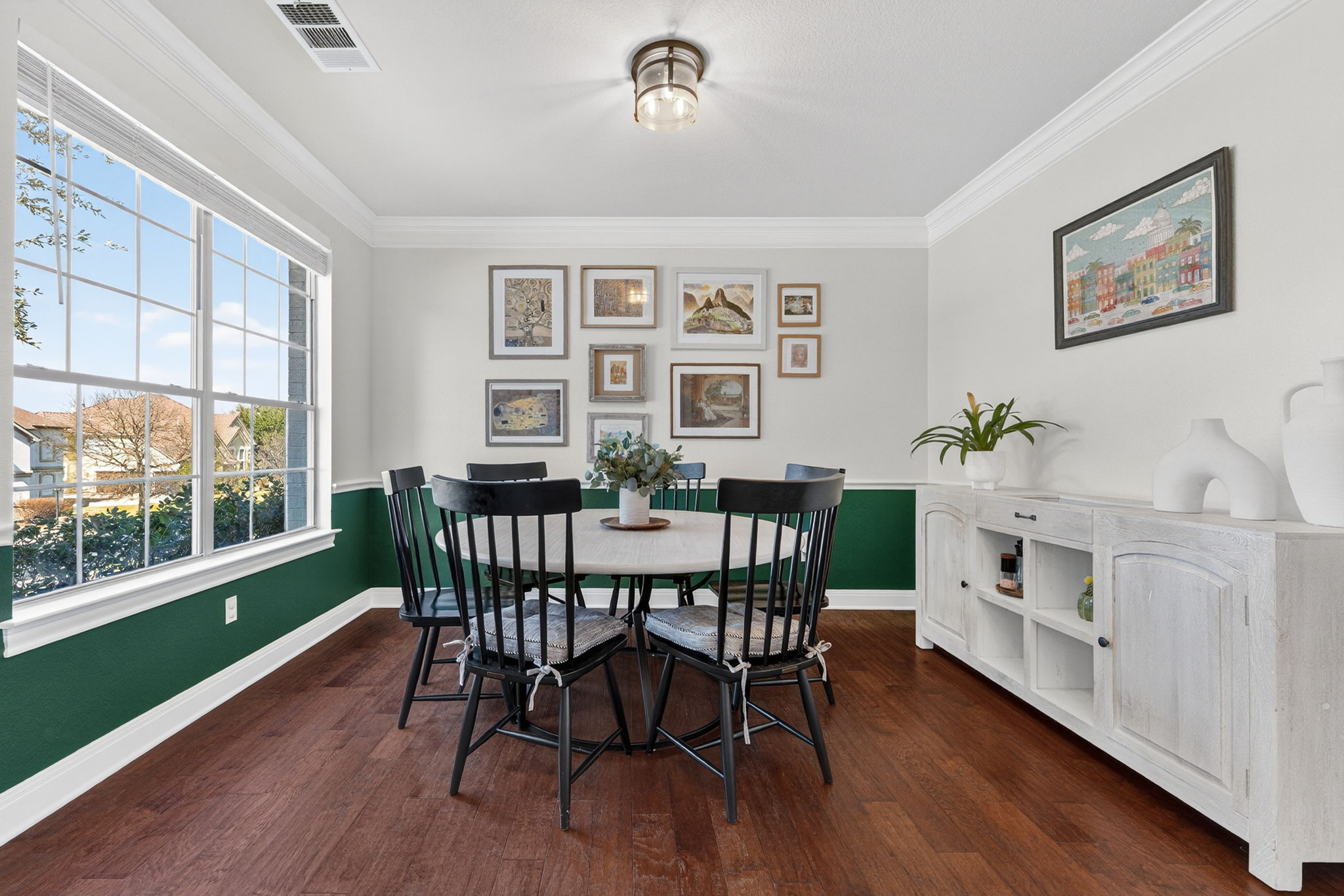 117 Lakota Pass Austin, TX 78738 - Photo 3 of 18 A spacious dining area at the front of the home features large windows and plenty of room to host family gatherings and special occasions.