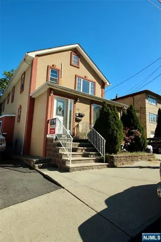 a front view of house with street