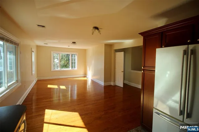 a view of a hallway with windows
