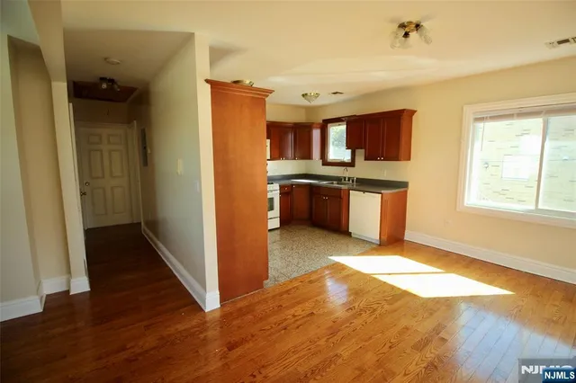 a kitchen with stainless steel appliances granite countertop a stove and a refrigerator