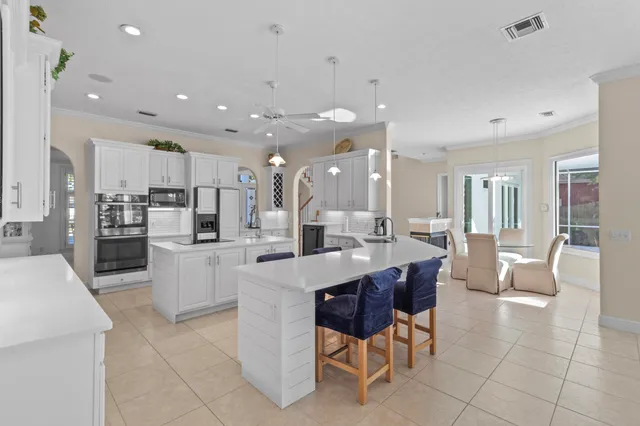 a view of a dining room with furniture wooden floor and chandelier