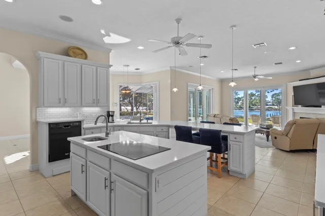 a bathroom with a double vanity sink toilet and shower