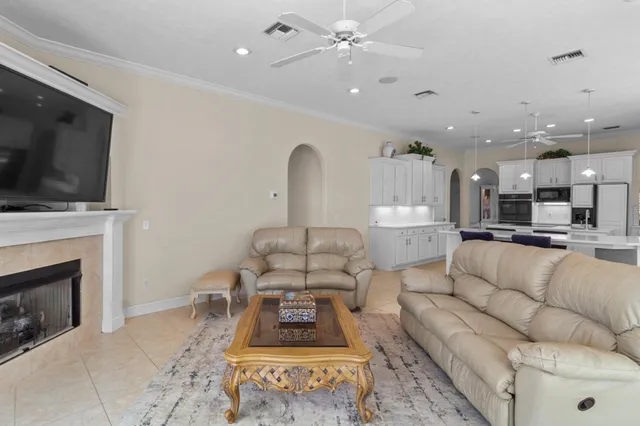a view of a livingroom with an empty space and a fireplace