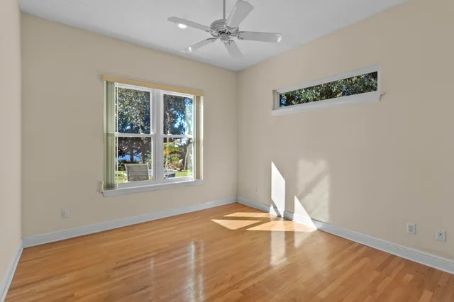 a view of living room with furniture and wooden floor