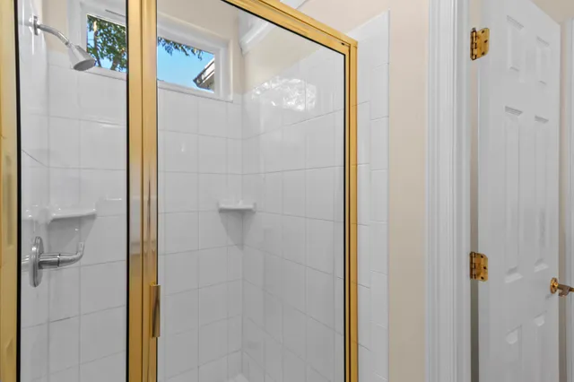 a living room with furniture a table and painting on the wall