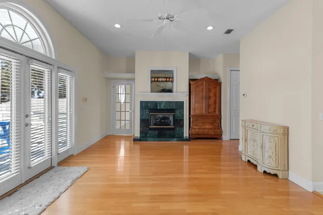 a view of a lake with a house next to a yard