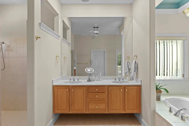 a view of a grey house with a yard