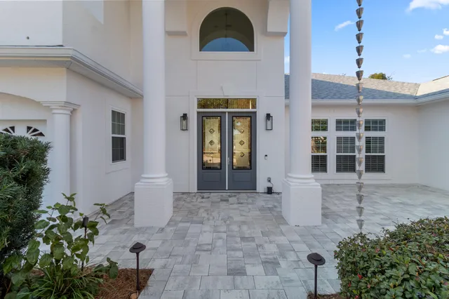 a view of a dining room with furniture wooden floor and chandelier