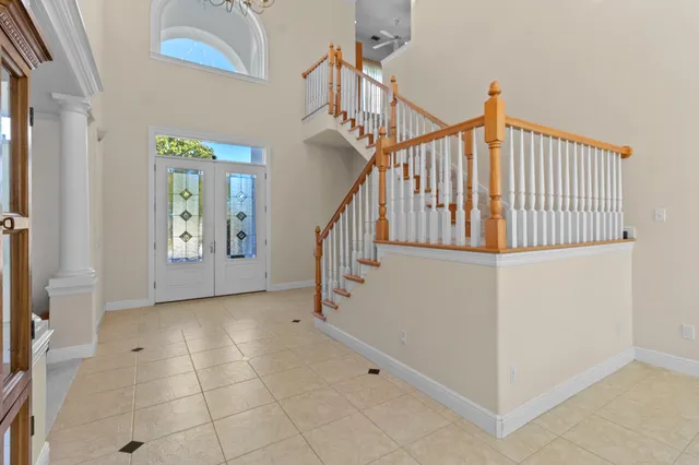 a view of a dining room with furniture wooden floor and chandelier