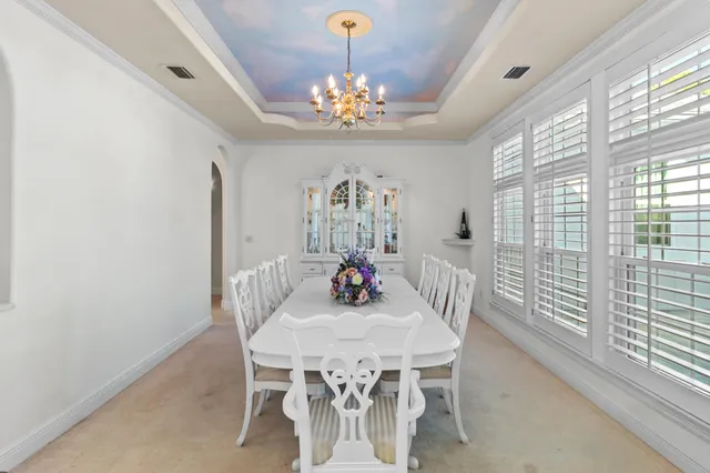a large kitchen with kitchen island a sink stainless steel appliances and cabinets