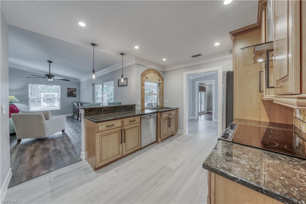 310 27th Street Southwest Naples, FL 34117 - Photo 7 of 22 kitchen open to family room
