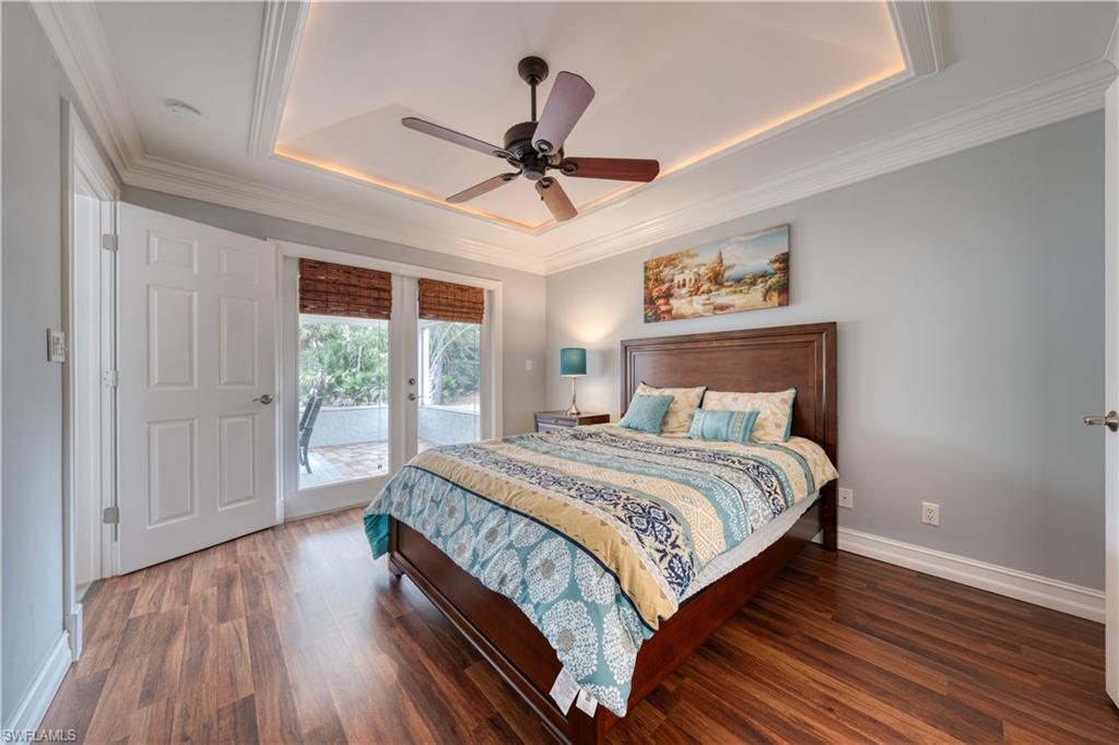 310 27th Street Southwest Naples, FL 34117 - Photo 10 of 22 Primary suite with access to lanai