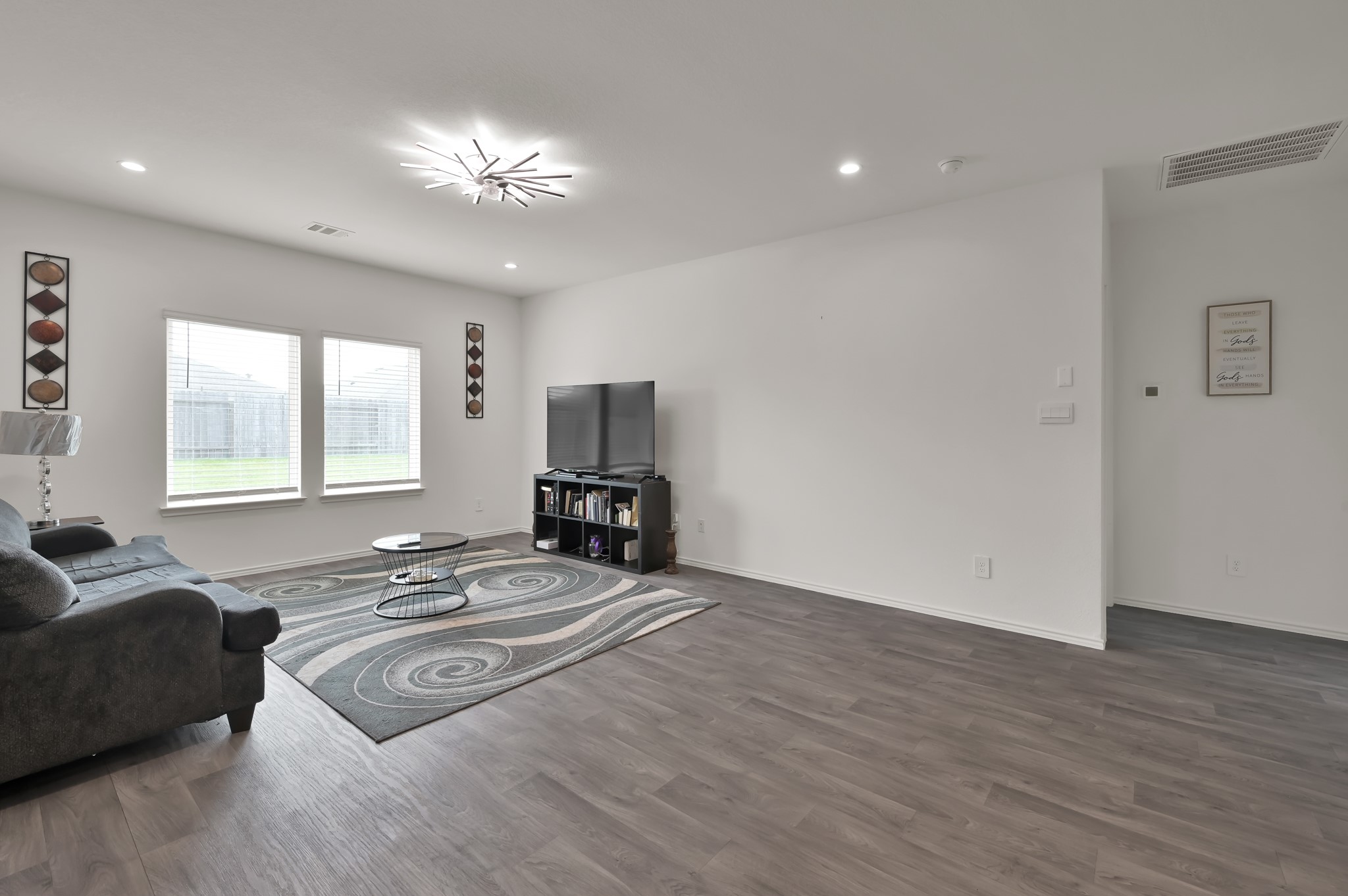 14212 Dream Road New Caney, TX 77357 - Photo 11 of 37 a spacious bedroom with a bed and a couch