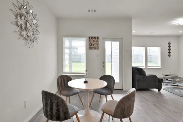 a living room with furniture and a table