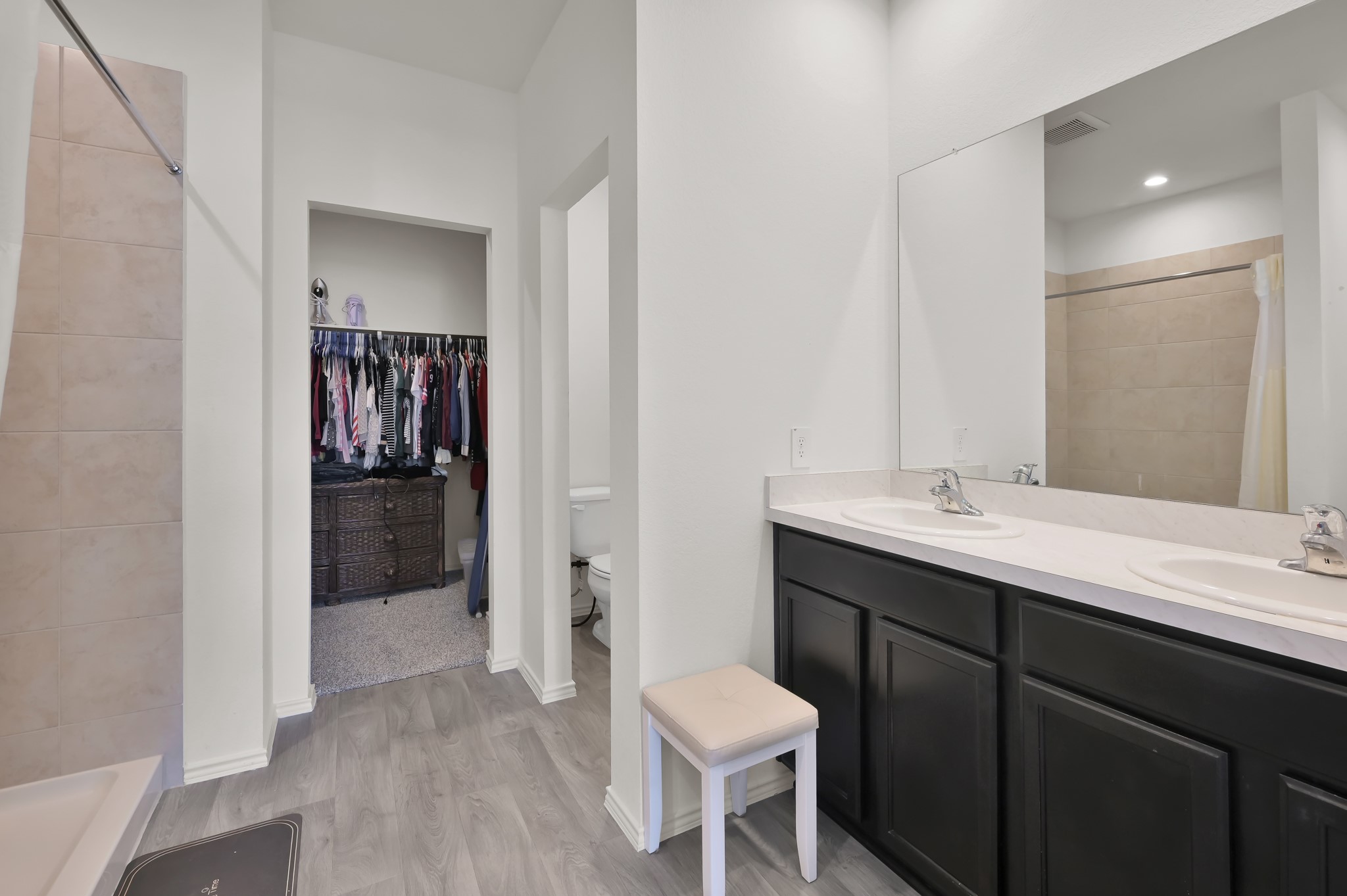 14212 Dream Road New Caney, TX 77357 - Photo 19 of 37 a bathroom with a sink and a mirror