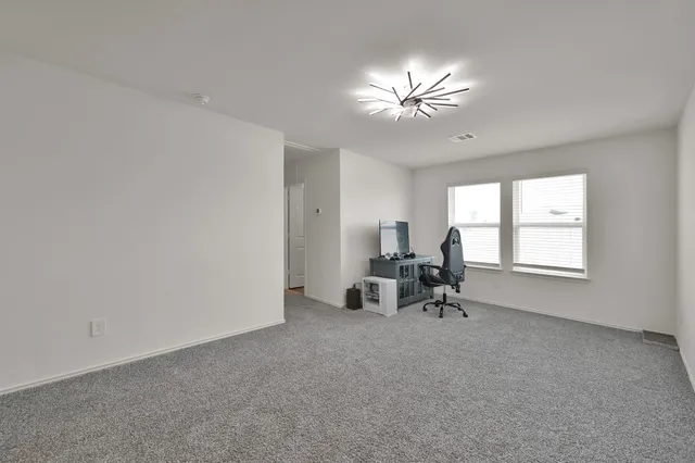 a view of livingroom with window and furniture