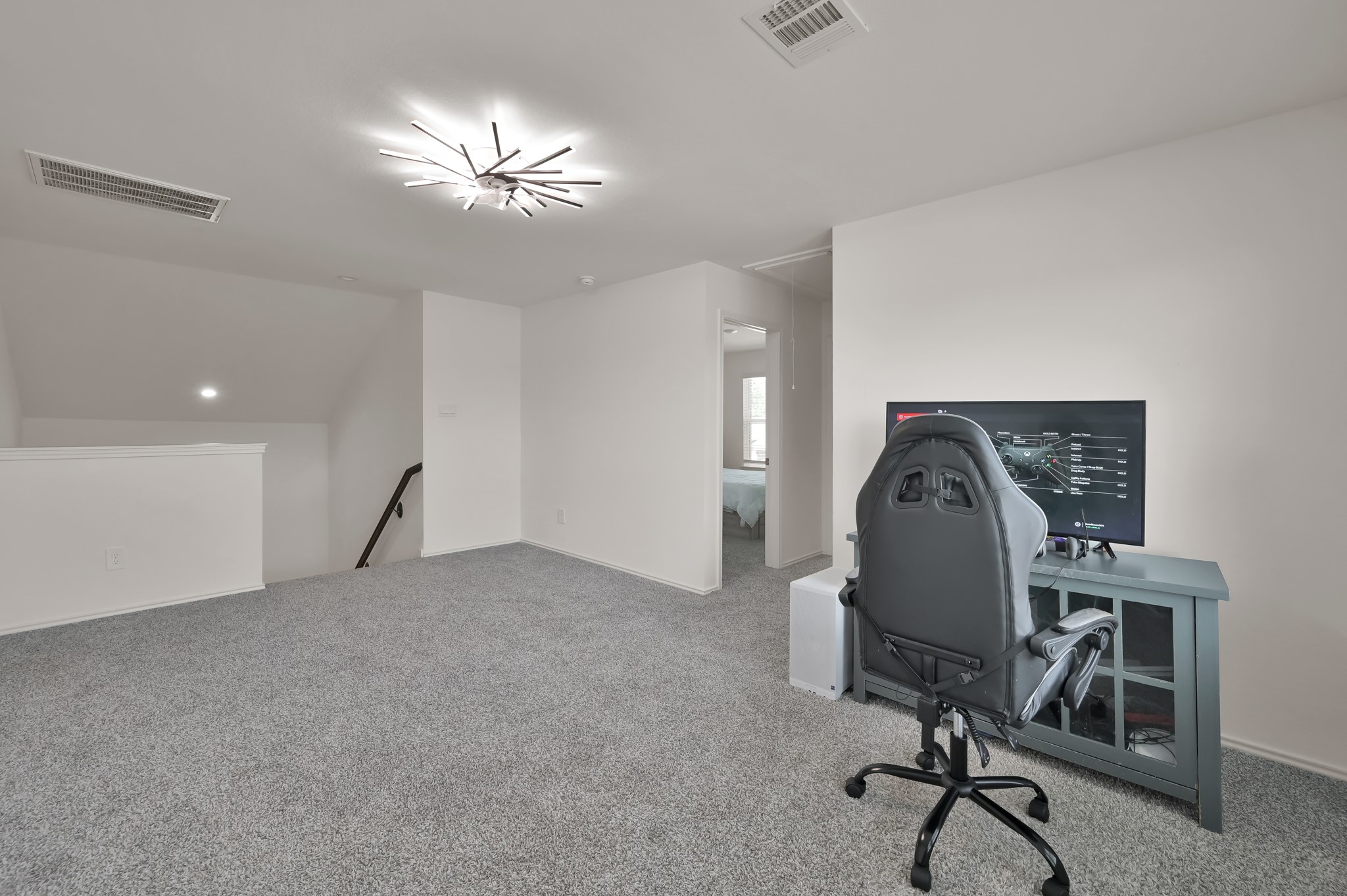 14212 Dream Road New Caney, TX 77357 - Photo 23 of 37 a view of a workspace with furniture and a chandelier