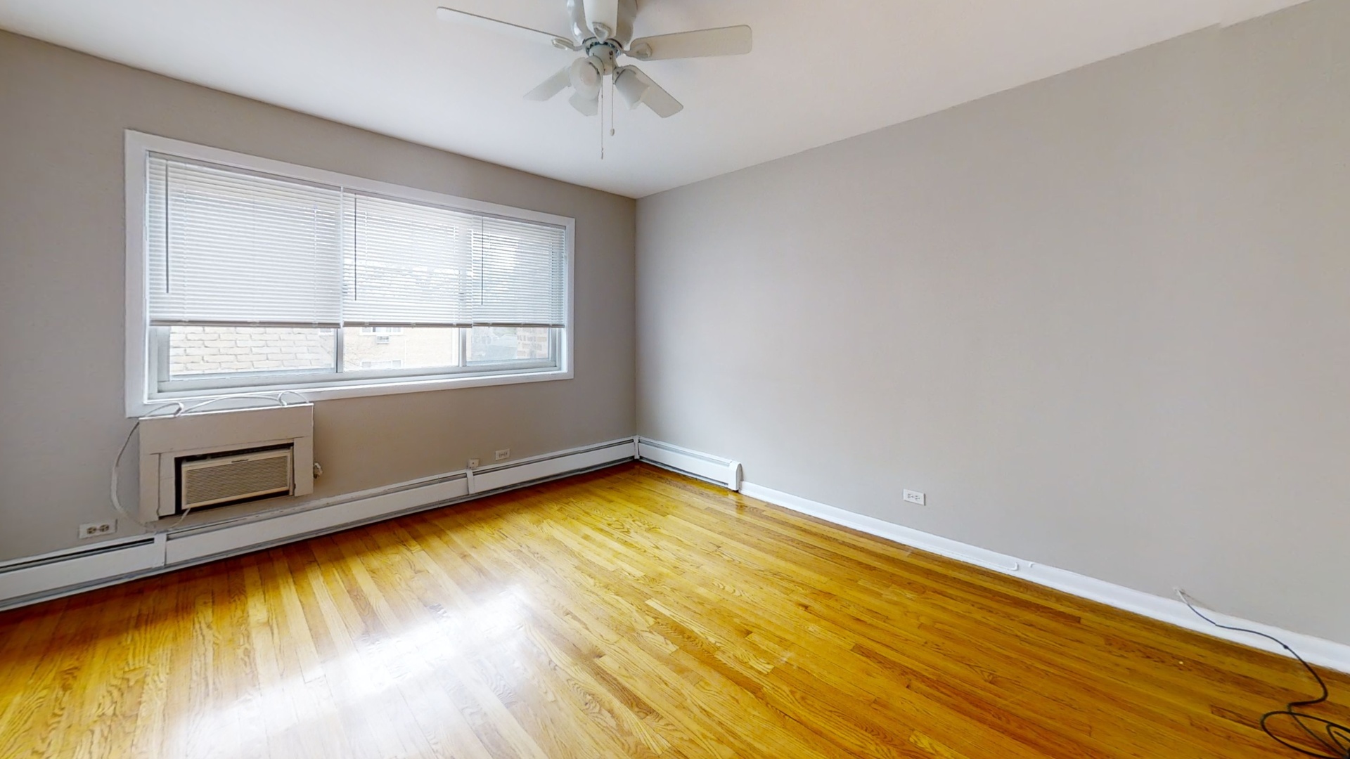 828 Seward Street, Unit 2E Evanston, IL 60202 - Photo 12 of 12 a view of a room with wooden floor and cabinet