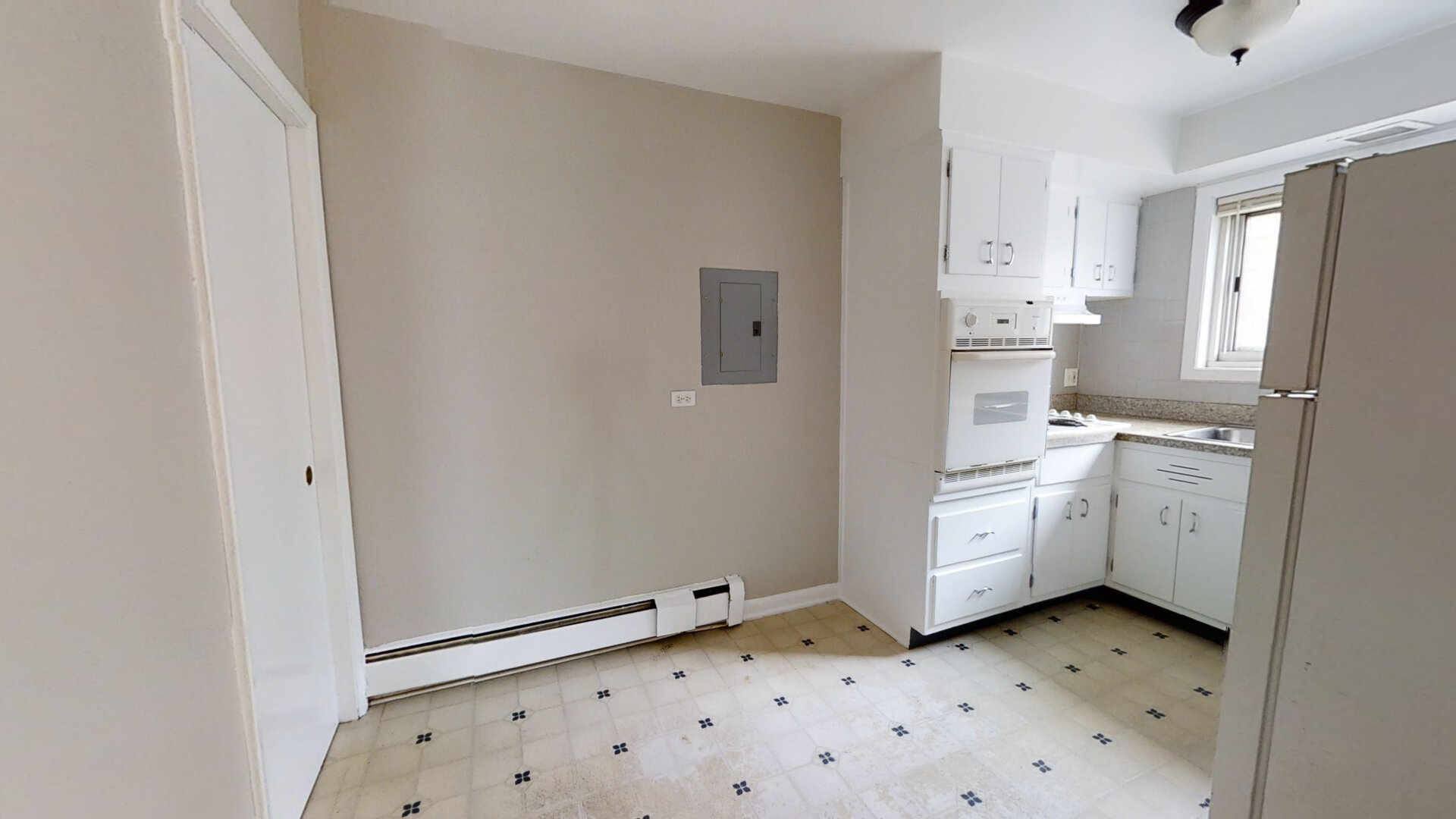 828 Seward Street, Unit 2E Evanston, IL 60202 - Photo 4 of 12 a room with white cabinets and appliances