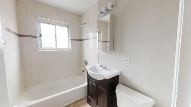 a bathroom with a sink toilet and bathtub