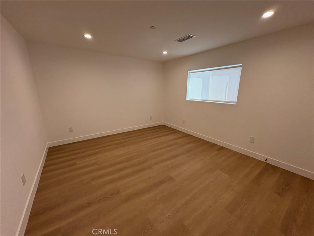 14165 Calvert Street Van Nuys, CA 91401 - Photo 13 of 21 wooden floor in a room
