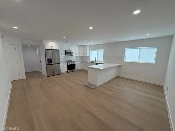 a view of a kitchen with a sink cabinets and a window