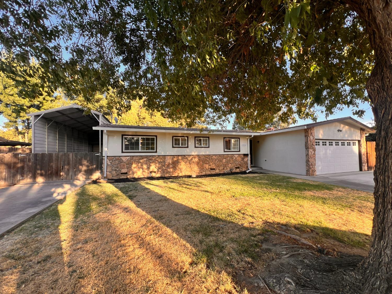 550 Curry Avenue Modesto, CA 95354 - Photo 1 of 1 a view of a house with swimming pool and sitting area