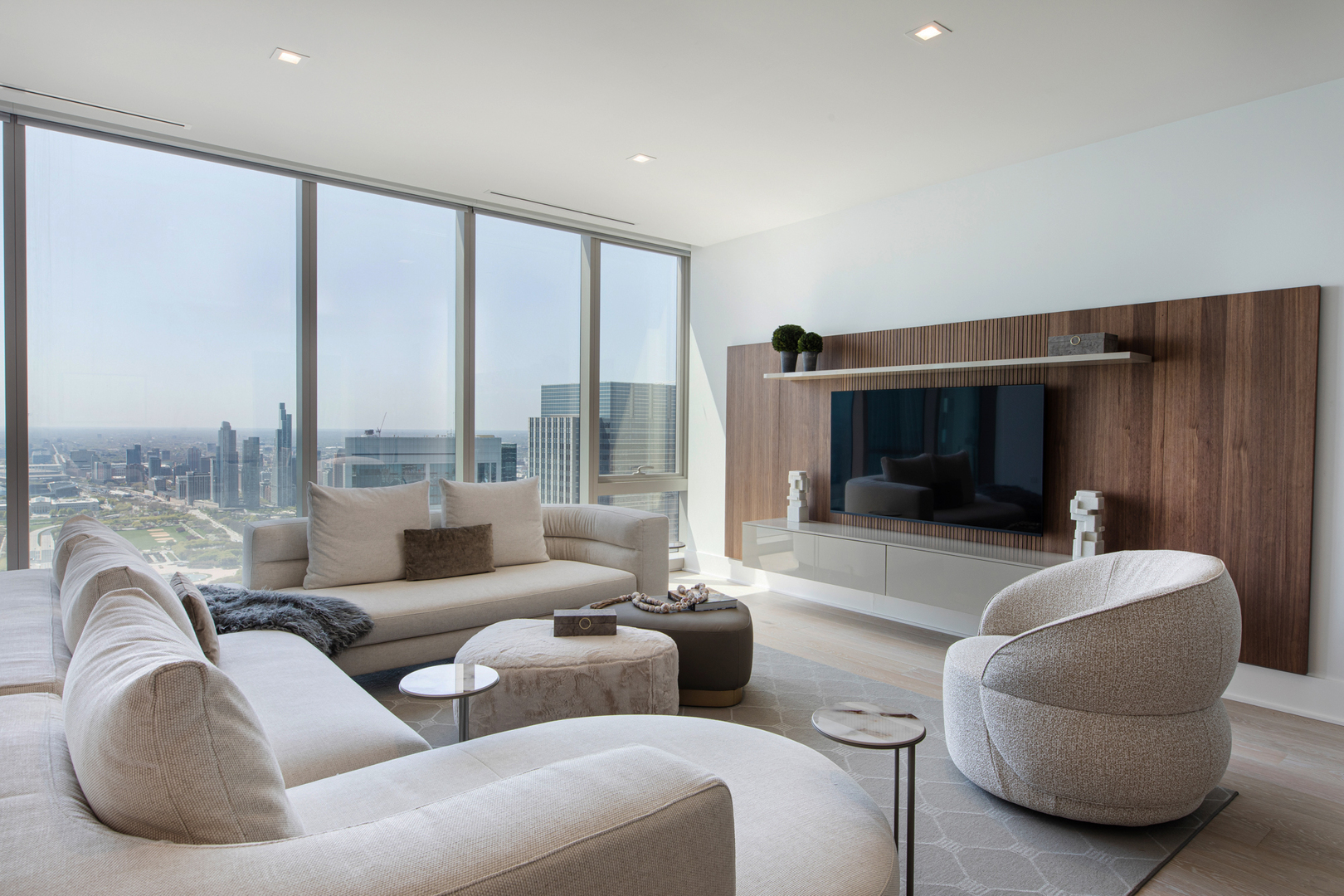 363 East Wacker Drive, Unit 6603 Chicago, IL 60601 - Photo 21 of 21 a living room with furniture and a flat screen tv