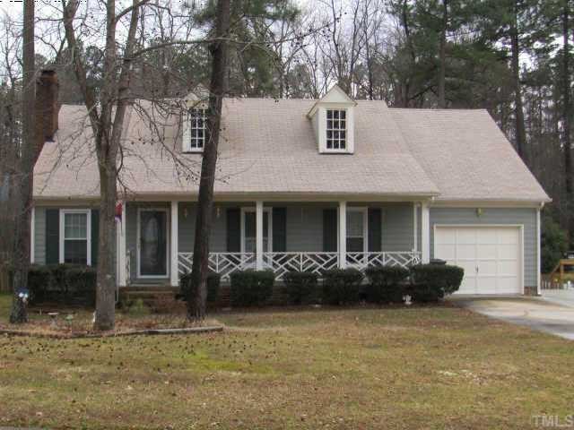 11925 North Exeter Way Raleigh, NC 27613 - Photo 1 of 10 a front view of a house with lots of trees