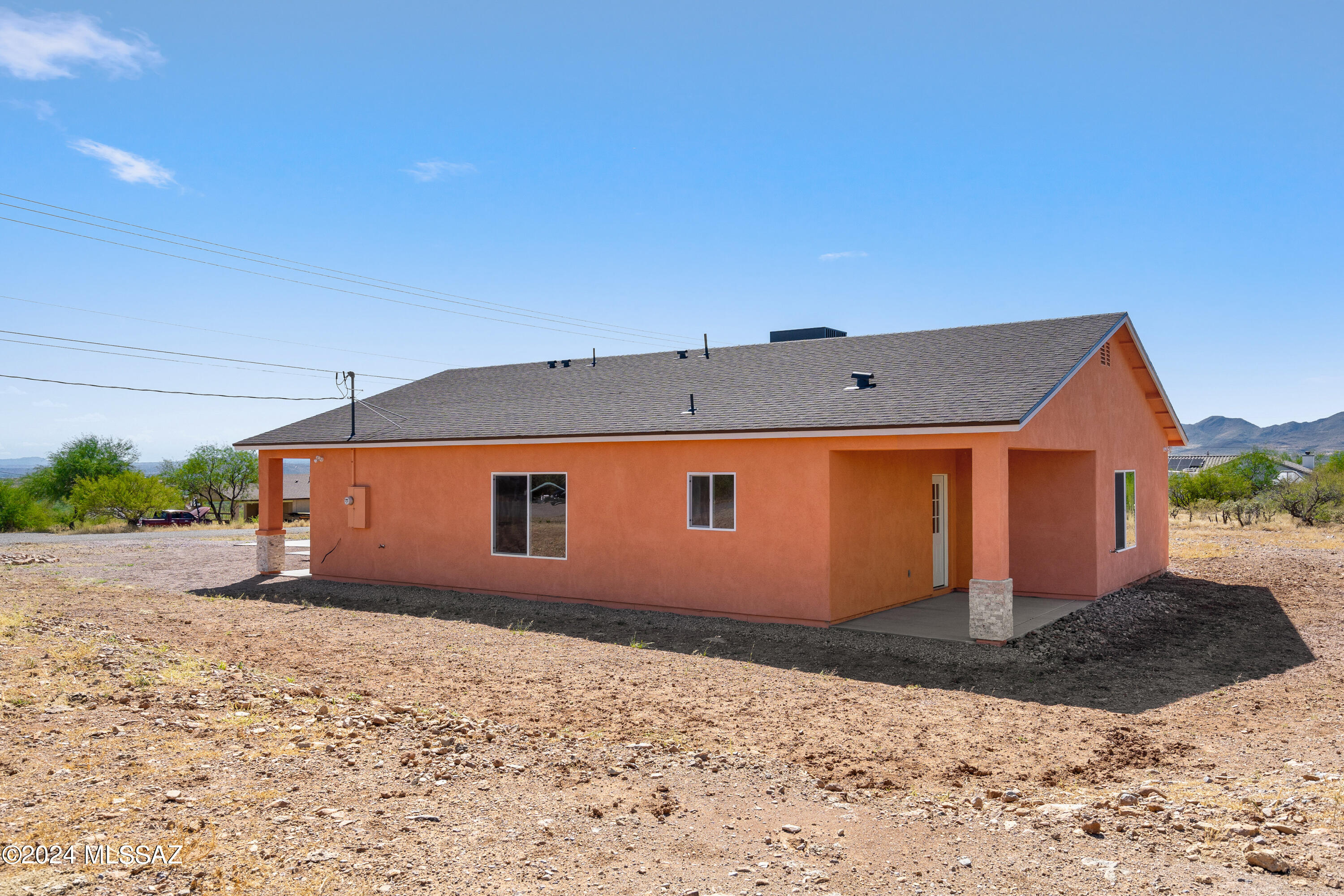 91 Avenida De Las Naciones Rio Rico, AZ 85648 - Photo 25 of 36 a front view of a house with a yard