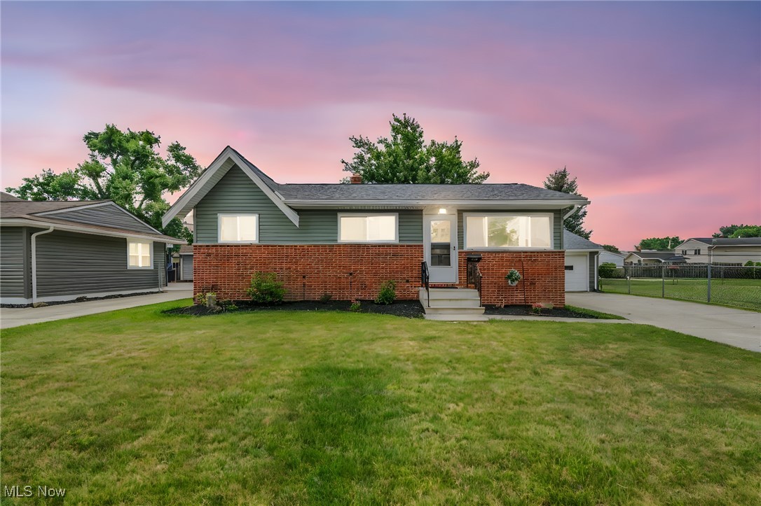 15025 Holland Road Brook Park, OH 44142 - Photo 1 of 12 Ranch-style home featuring brick siding and concrete driveway