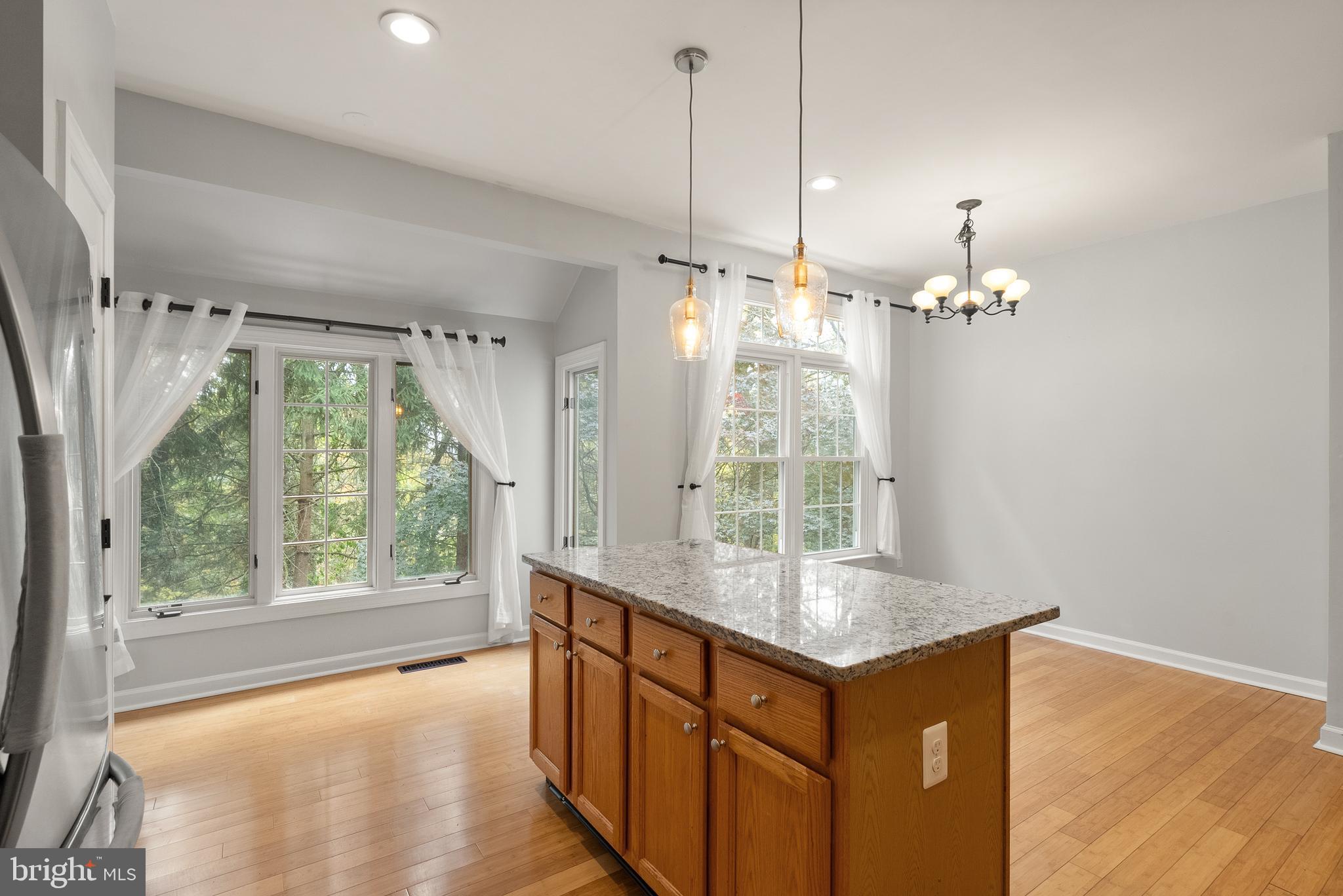 3601 Ransom Place Alexandria, VA 22306 - Photo 23 of 60 a bathroom with a granite countertop sink a large mirror and a large window