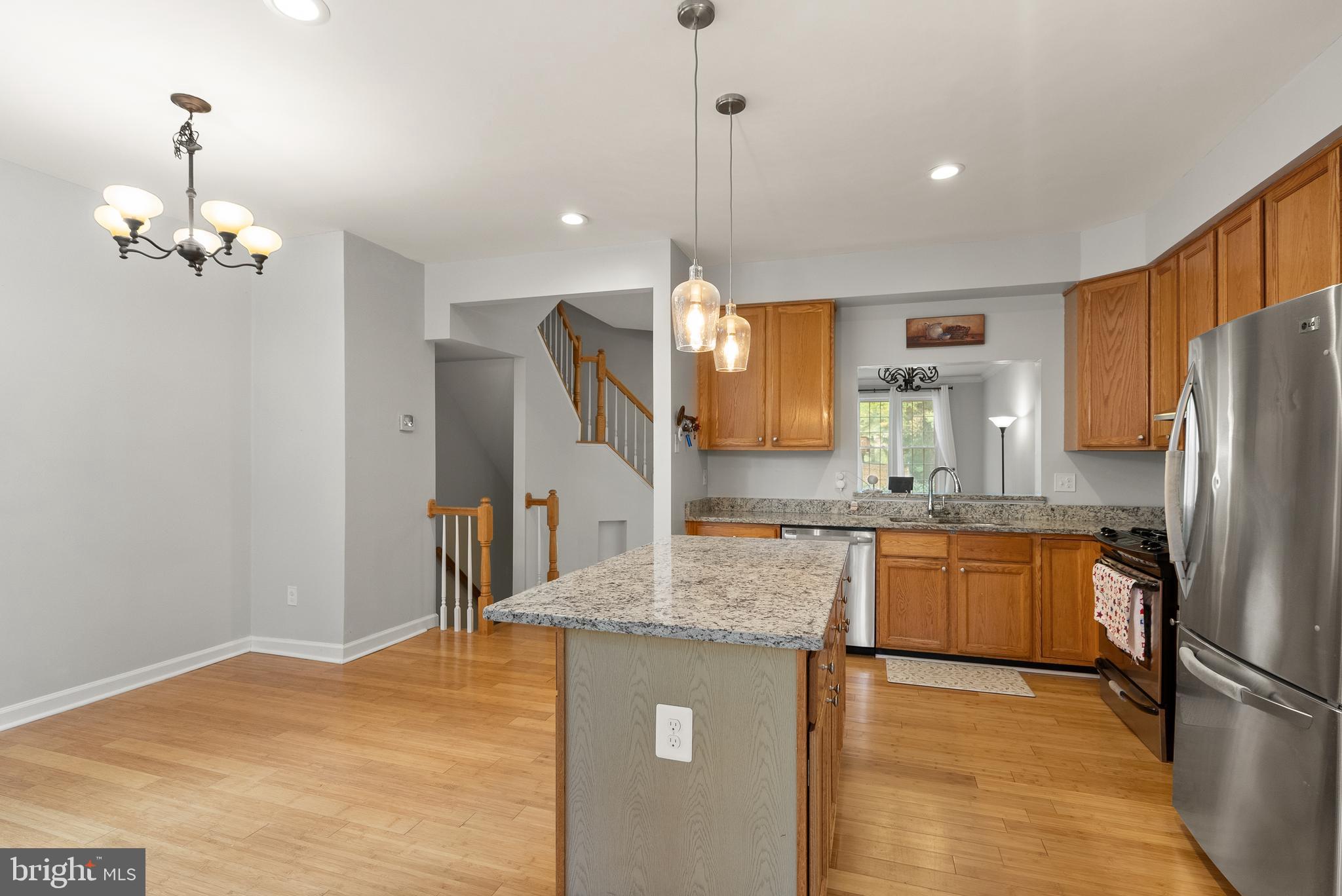 3601 Ransom Place Alexandria, VA 22306 - Photo 25 of 60 a kitchen with stainless steel appliances granite countertop a sink refrigerator and cabinets