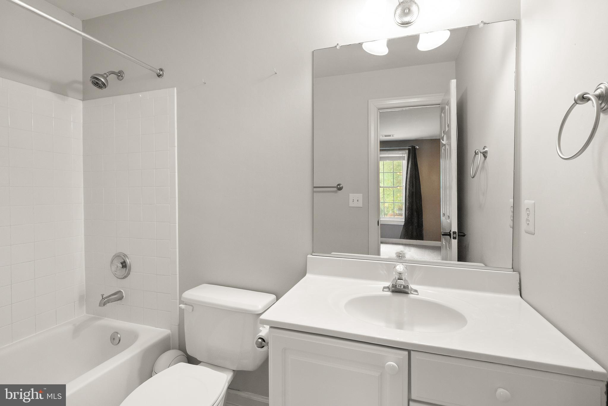 3601 Ransom Place Alexandria, VA 22306 - Photo 44 of 60 a bathroom with a sink a toilet and a mirror