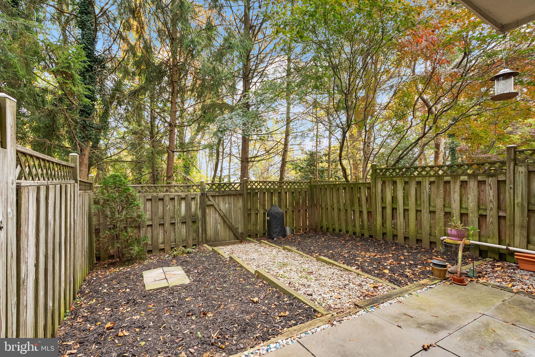 3601 Ransom Place Alexandria, VA 22306 - Photo 56 of 60 a view of a backyard with wooden fence and large trees