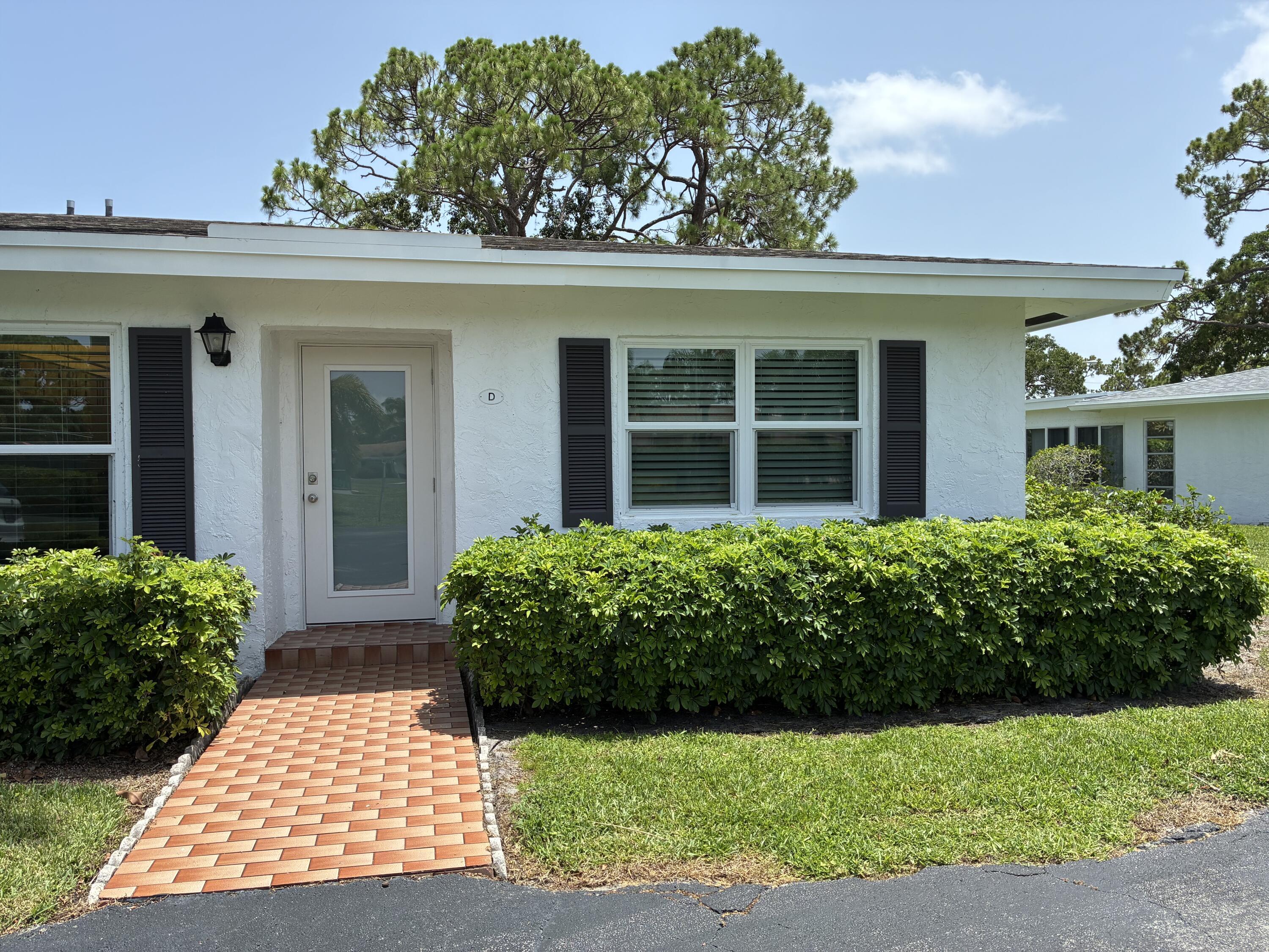 5178 Privet Place, Unit D Delray Beach, FL 33484 - Photo 1 of 41 front view of a house with a yard