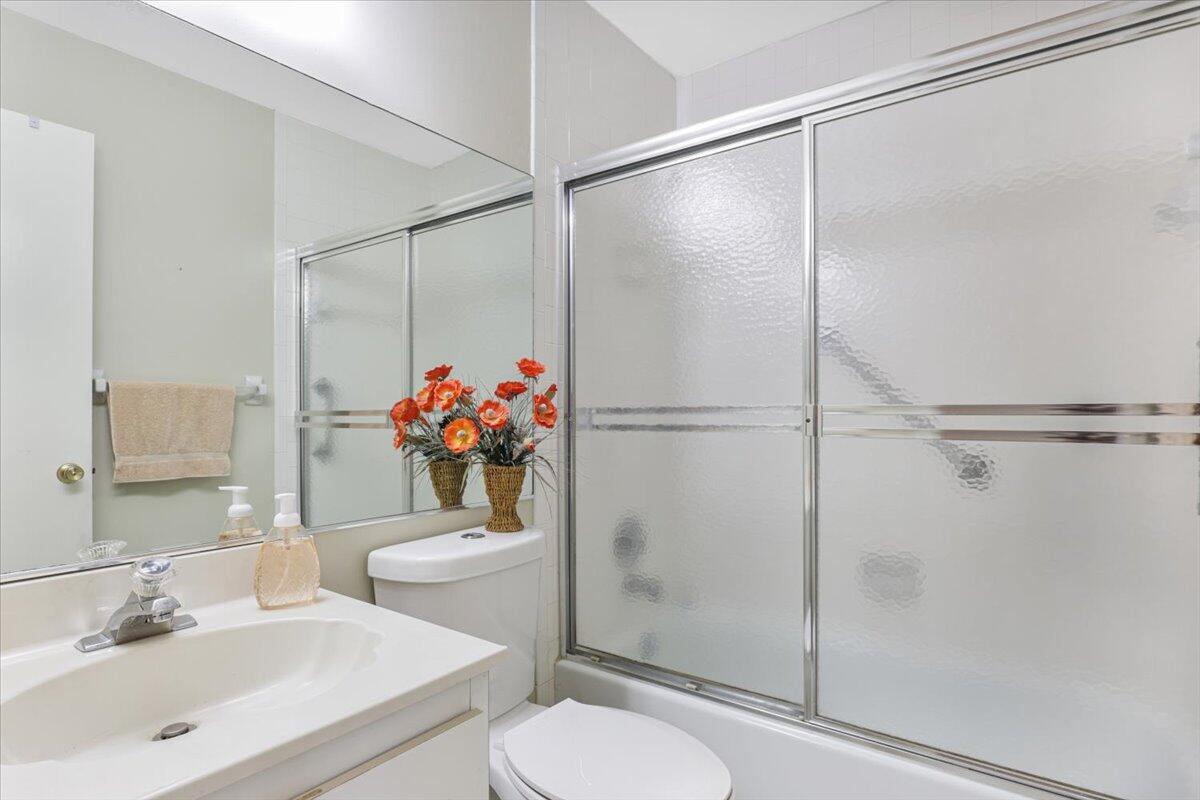 5178 Privet Place, Unit D Delray Beach, FL 33484 - Photo 12 of 41 a bathroom with a sink toilet and shower